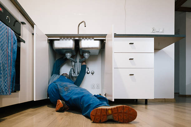 Professional Emergency Plumber technician working in Monroe Center, IL